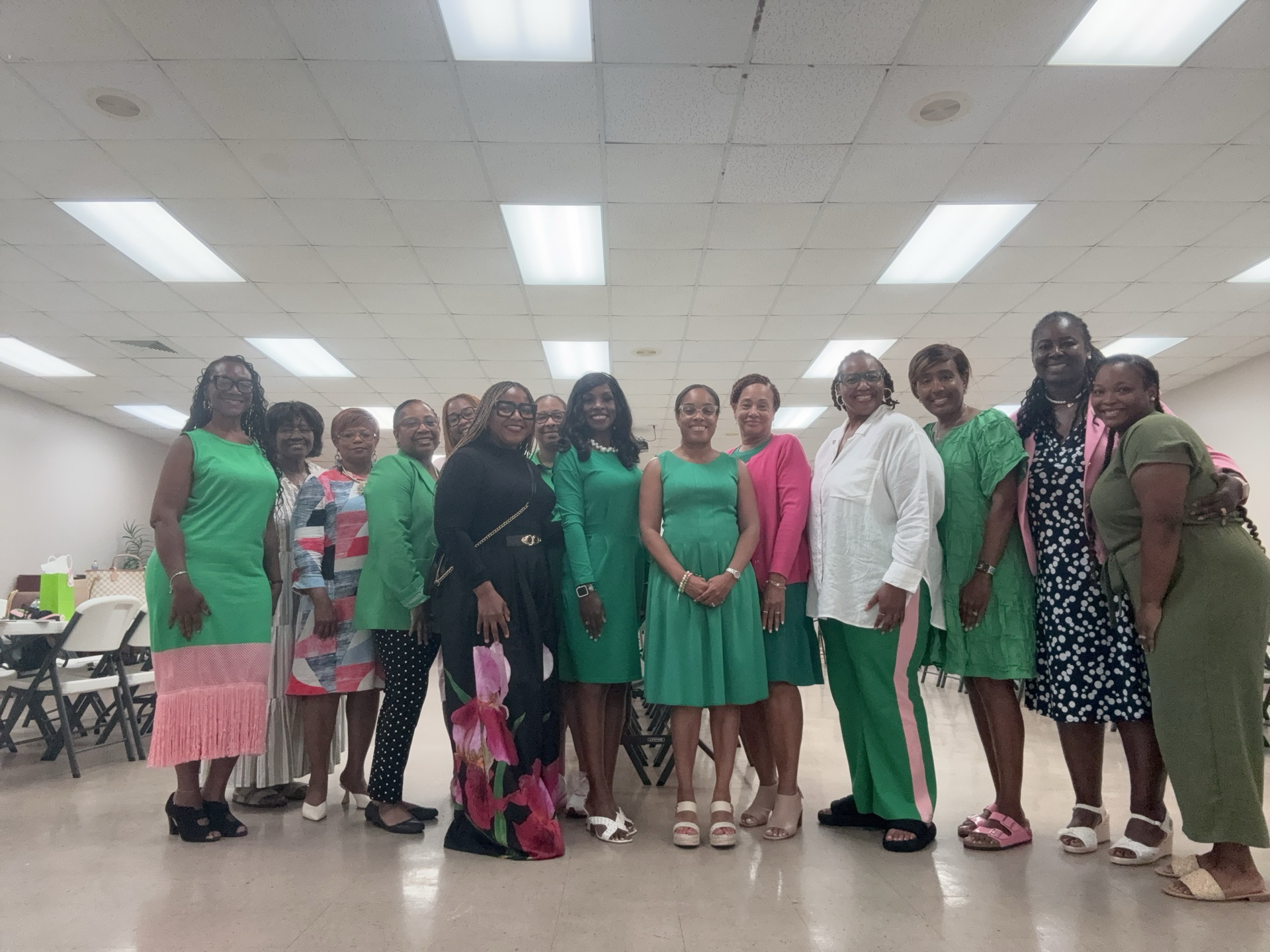 People posing together, wearing colorful outfits