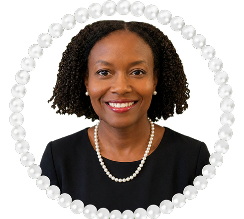 Portrait of woman with curly hair, pearls