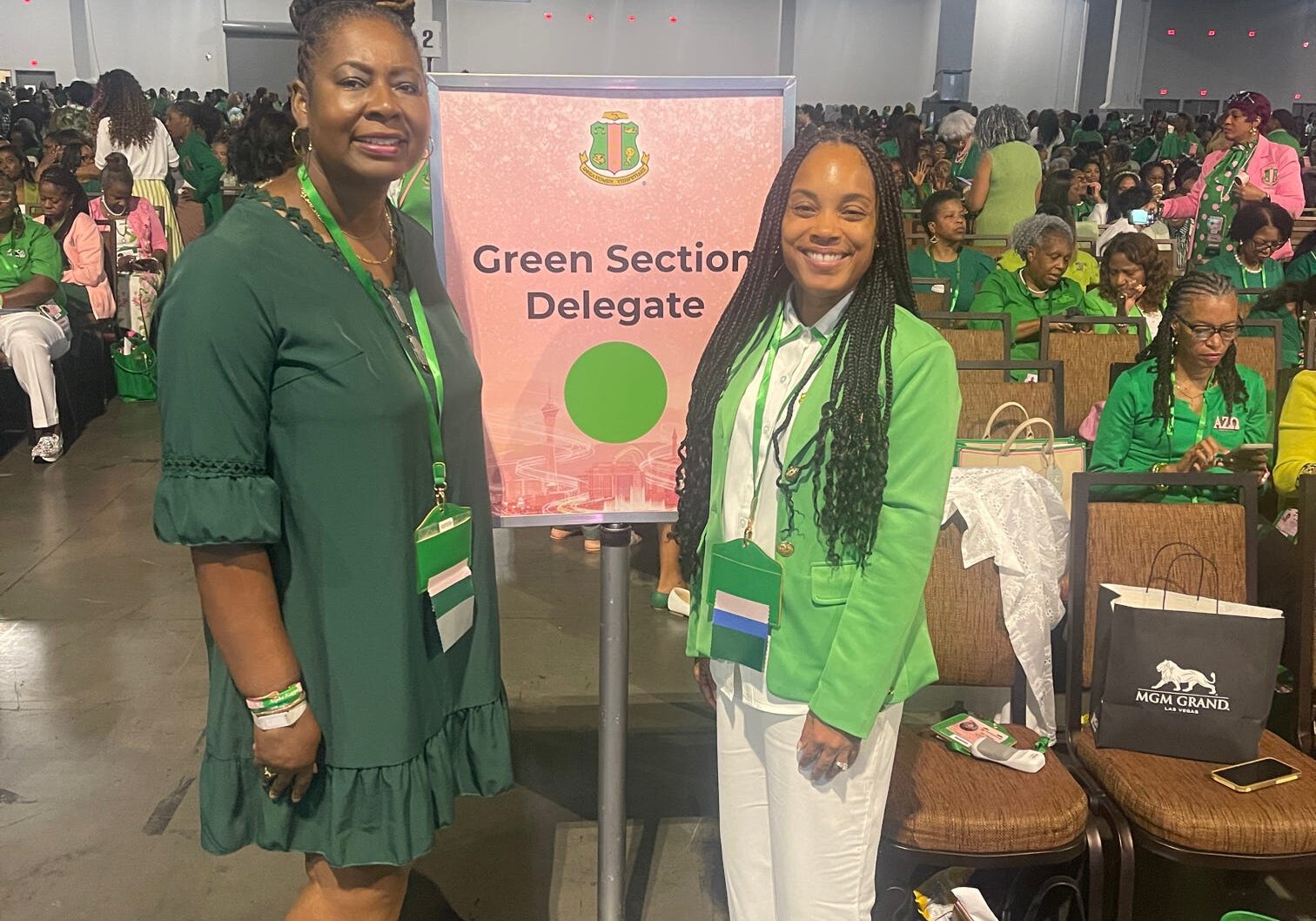 Green Section Delegate sign with two women